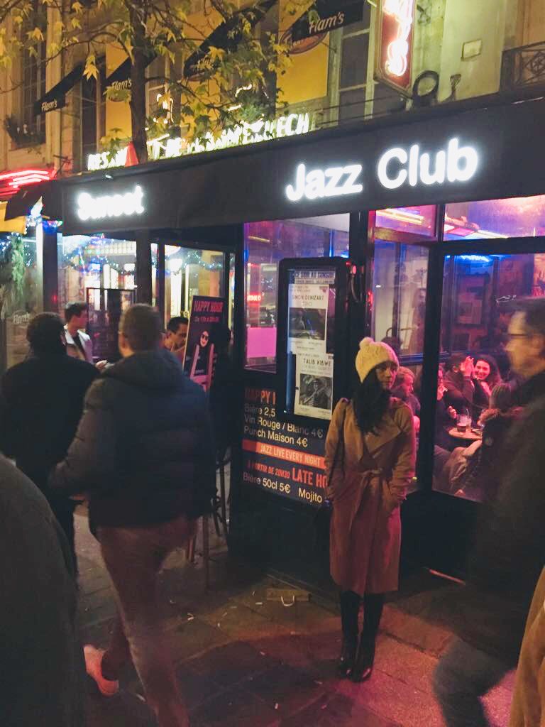 Rebecca Baatjes outside Sweet Jazz Club in Paris at night